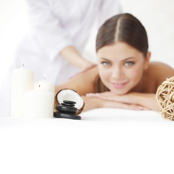 Beautiful young woman getting spa massage close up