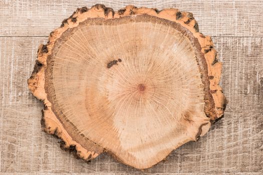 Wood plank board on wooden table, useful as a background. Top view with copy space.