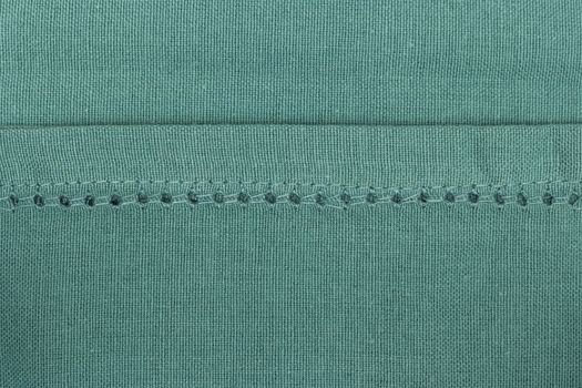 Green towel fabric. Tablecloth texture. Cotton texture closeup, background