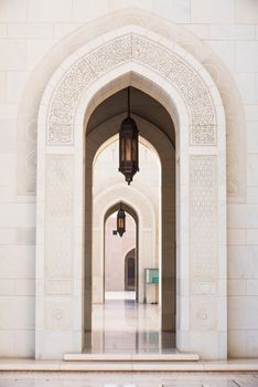 Gates surrounded by scriptures from the Quran at Sultan Qaboos Grand Mosque in Muscat, the main mosque of The Sultanate of Oman.