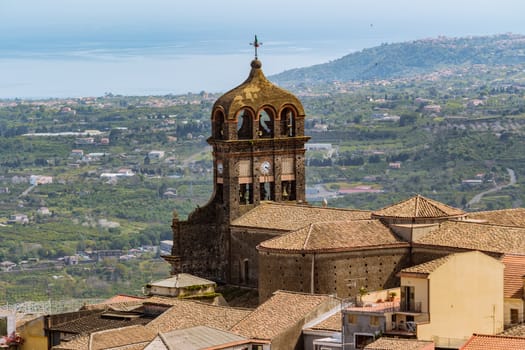 The view of church and houses in an italian valley