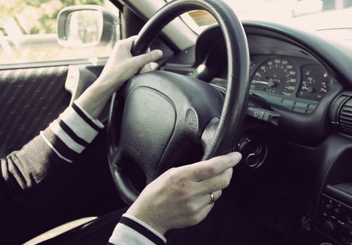 Female driving car. Vintage look