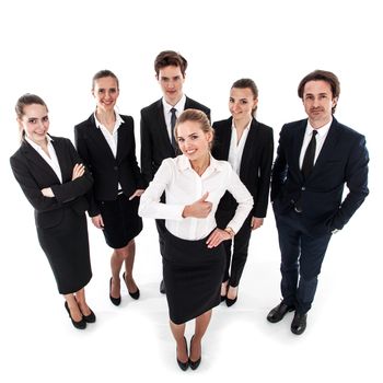 Successful young business woman showing thumbs up sign and her team isolated on white background