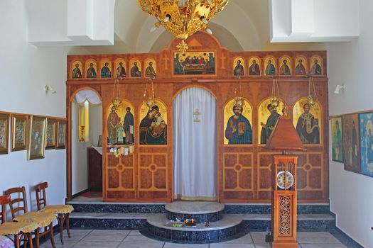Interior of a small orthodox church with the characteristic color and architecture typically found on the Aegean islands. Sfakia village. Kos island, Greece.