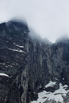 The Troll Wall in Norway, magestic summer foggy mountains