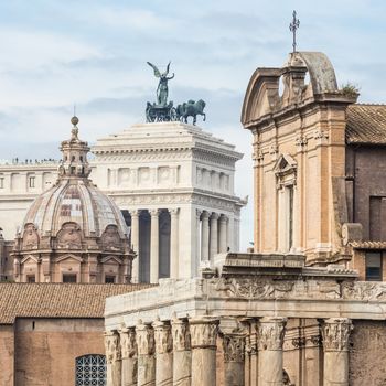 Compressed perspective of Roman lendmarks. Ruins of the Roman Forum, Basilica di Santa Maria in Ara coeli, Mamertine Prison, Curia Iulia and Terrazza delle Quadrighe in Rome, Italy.