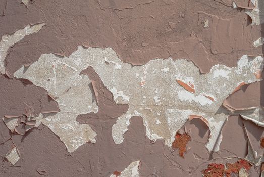 fragment of a concrete wall, which has undergone deformation due to prolonged exposure to various climatic conditions