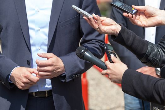 Journalists making interview with businessman or politician