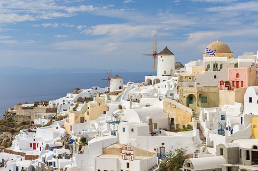 Famous view of Oia village at the Island Santorini, Greece in sunset rays