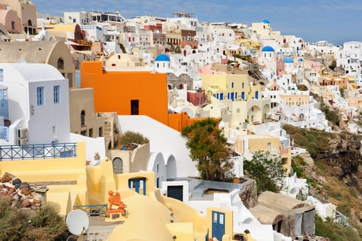 View of Oia village at the Island Santorini, Greece in sunset rays