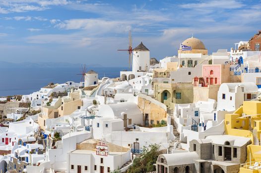 Famous view of Oia village at the Island Santorini, Greece in sunset rays