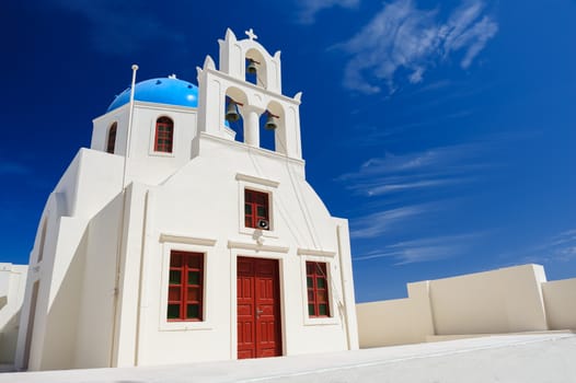 Blue and white orthodox church bell tower. Oia, Santorini Greece. Copyspace