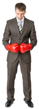 Businessman in boxing gloves isolated on white background