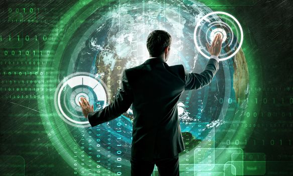 Businessman in suit against digital background with icons and earh globe. Elements of this image furnished by NASA