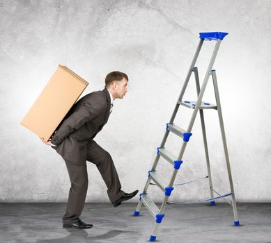 Middle aged business man with difficult task going up ladder