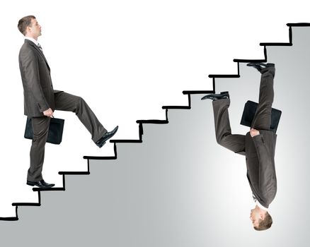 Two business men walking up stairs in different sides