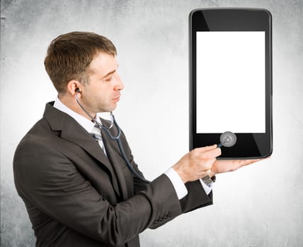 Businessman listening to smartphone within stethoscope, cure concept