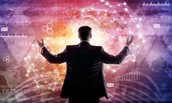 Young businessman raised his hands. Media screen with icons as backdrop. Rear view. Elements of this image furnished by NASA
