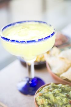 Celebrating Cinco de Mayo with a margarita and Mexican appetizers.