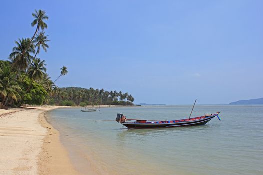 Tropical beach in Thong Krut village. Koh Samui island, Thailand.