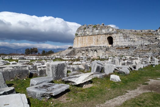 View of Miletus Ancient City ruins in Aydin, Turkey from prehistoric time, on bright blue sky background.