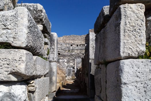 View of Miletus Ancient City ruins in Aydin, Turkey from prehistoric time, on bright blue sky background.