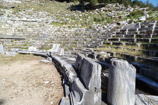 General temple view of Priene Ancient City in Aydın, Turkey, on bright blue sky background.