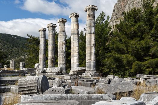 General temple view of Priene Ancient City in Aydın, Turkey, on bright blue sky background.