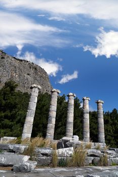 General temple view of Priene Ancient City in Aydın, Turkey, on bright blue sky background.