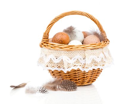 Eggs in basket isolated on white background