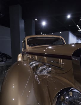 Los Angeles, CA, USA — April 16, 2016: Gold 1937 Delage D8-120 Coupe Aerosport by Letourneur et Marchand at the Petersen Automotive Museum in Los Angeles, California, United States. Editorial use