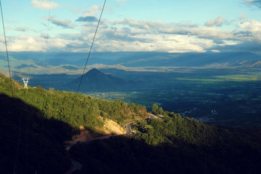 Amazing landscape of Ngoan Muc mountain pass, a dangerous road link Phan Rang with Dalat of Vietnam, beautiful scene with mountain terrain among forest in evening