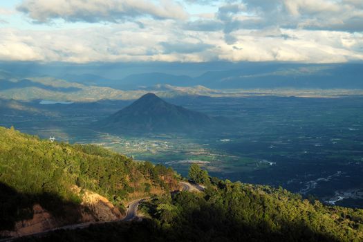 Amazing landscape of Ngoan Muc mountain pass, a dangerous road link Phan Rang with Dalat of Vietnam, beautiful scene with mountain terrain among forest in evening