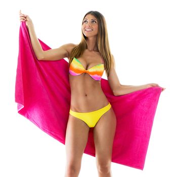 Beautiful young woman smiling and posing in bikini with pink towel. 