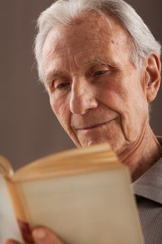 Elderly senior men sitting and reading book