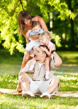 Beautiful family playing in the park