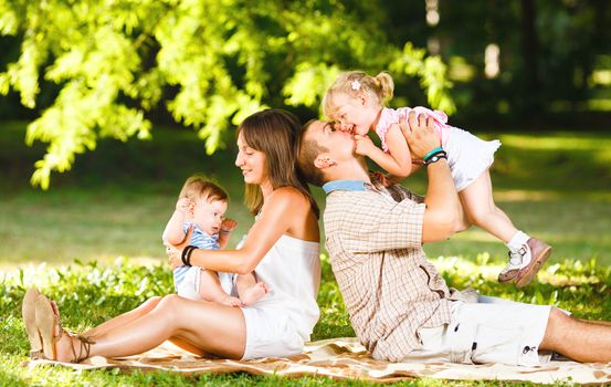 Beautiful family playing in the park