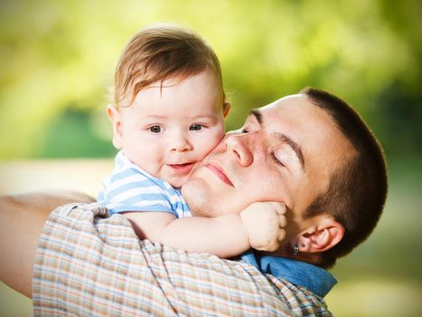 Father and son hugging each other