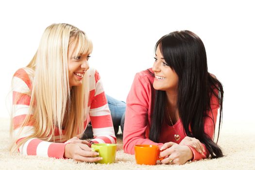 Beautiful girls drink tea and and talking together