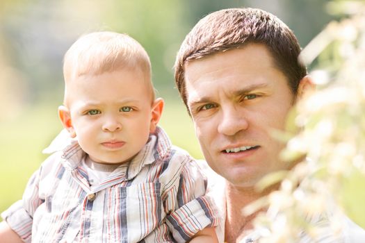 Father and son portrait in the nature