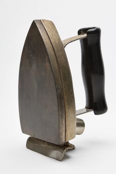 Side view of an antique electric iron