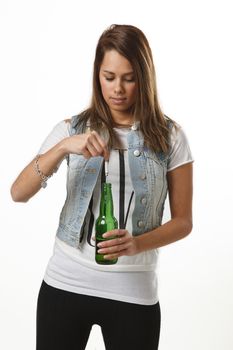 twenty something girl putting a cigarette into a beer bottle
