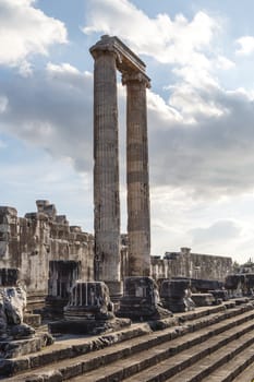 View of Apollon Temple in Didyma Ancient City in Aydın Turkey, on cloudy blue sky bakcground.