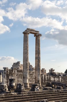 General view of ruins of Apollon Temple in Didyma Ancient City, on cloudy blue sky background.