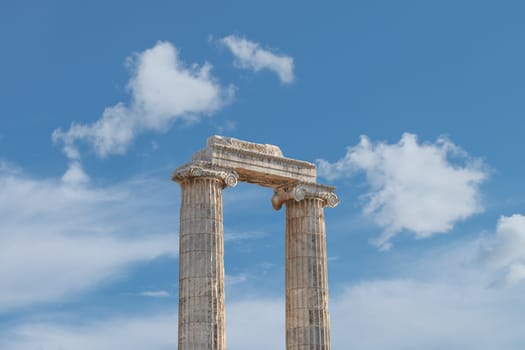 General view of ruins of Apollon Temple in Didyma Ancient City, on cloudy blue sky background.