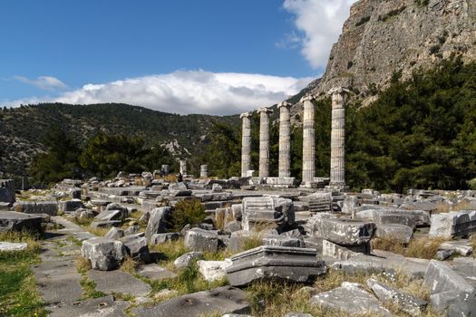 General temple view of Priene Ancient City in Aydın, Turkey, on bright blue sky background.