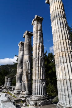 General temple view of Priene Ancient City in Aydın, Turkey, on bright blue sky background.