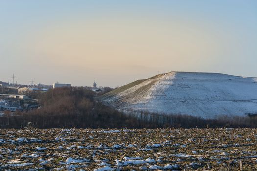 Snowy Mountain a landfill, dump in the winter.