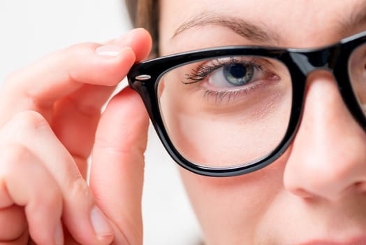 closeup of black sunglasses and female eyes