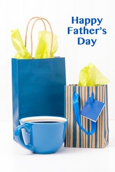 A cup of coffee and gifts for dad on fathers Day.